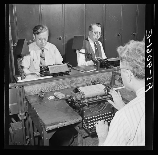 New York, New York. Wire room of the New York Times newspaper. Telegraphers receive and record messages received by Western Union and Postal Telegraph from Times correspondents all over the United States and abroad