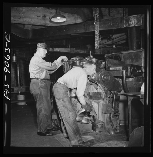 New York, New York. Pressroom of the New York Times newspaper. Casting of plates from mats in Autoplate machine
