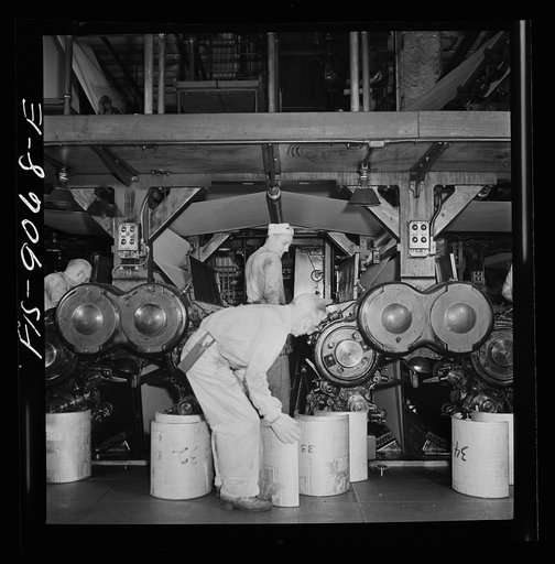 Pressroom of the New York Times newspaper. Numbering cast plates with page numbers for identification