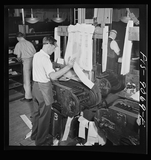 New York, New York. Composing room of the New York Times newspaper. Proof press turns out proofs for distribution to make-up editors for correction