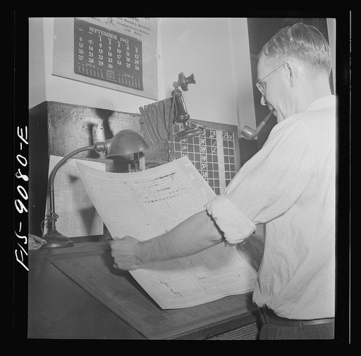 New York, New York. Composing room of the New York Times newspaper. Mats are checked for faults and blemishes
