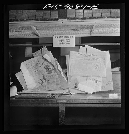 New York, New York. Composing room of the New York Times newspaper. Proofs on wall in the advertising end of the room
