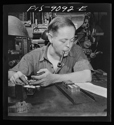 New York, New York. Composing room of the New York Times newspaper. Times daily index to the news is set partly by hand. This man has been doing it for fifteen years