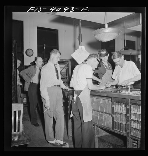 New York, New York. Composing room of the New York Times newspaper. Making up page one as deadline approaches