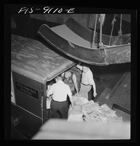 New York, New York. New York Times newspapers being loaded on trucks from mailroom