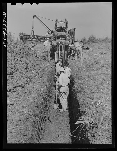 Arkansas-Texas state line to Gurdon, Arkansas War emergency pipeline from Longview, Texas to Norris City, Illinois. A trench-digging machine