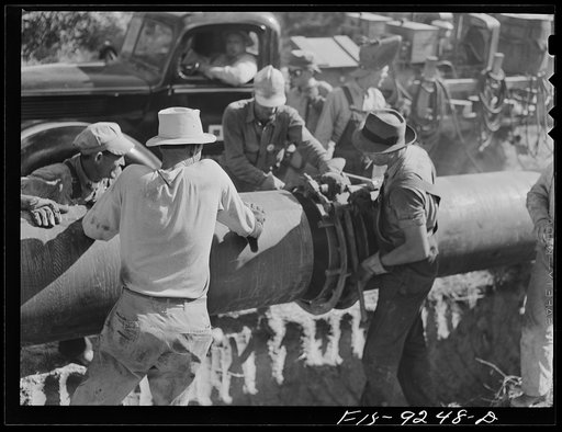 Little Rock, Arkansas to Missouri-Arkansas state line. War emergency pipeline from Longview, Texas to Norris City, Illinois. Joining forty-foot section of pipe to line before welding