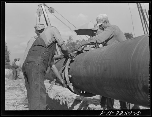 Untitled photo, possibly related to: Little Rock, Arkansas to Missouri-Arkansas state line. War emergency pipeline from Longview, Texas to Norris City, Illinois. Welding pipe by the stove pipe method