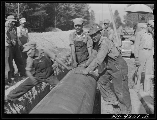 Untitled photo, possibly related to: Little Rock, Arkansas to Missouri-Arkansas state line. War emergency pipeline from Longview, Texas to Norris City, Illinois. Welding pipe by the stove pipe method