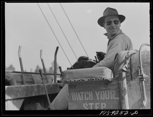 Untitled photo, possibly related to: Little Rock, Arkansas to Missouri-Arkansas state line. War emergency pipeline from Longview, Texas to Norris City, Illinois. Caterpillar operator getting a drink of water