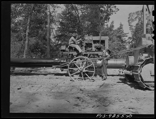 Untitled photo, possibly related to: Little Rock, Arkansas to Missouri-Arkansas state line. War emergency pipeline from Longview, Texas to Norris City, Illinois. Doping crew priming the pipeline