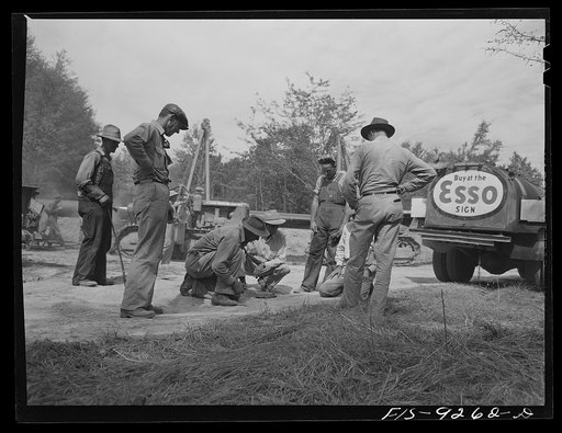 Untitled photo, possibly related to: Little Rock, Arkansas to Missouri-Arkansas state line. War emergency pipeline from Longview, Texas to Norris City, Illinois. Crap game during lunch hour