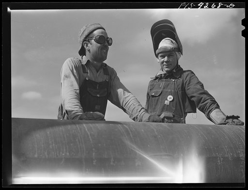 Untitled photo, possibly related to: Arkansas-Texas state line to Gurdon, Arkansas. War emergency pipeline from Longview, Texas to Norris City, Illinois. Electric welder and helper