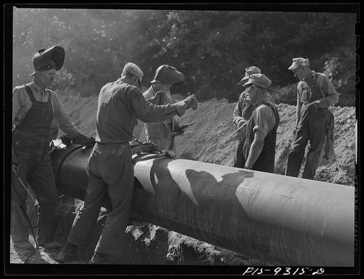 Little Rock, Arkansas to Missouri-Arkansas state line. War emergency pipeline from Longview, Texas to Norris City, Illinois. Joining a section of pipe to line already laid. This is the stove pipe method of welding