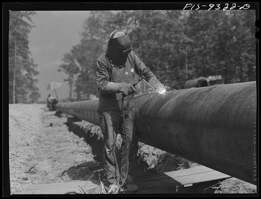 Arkansas-Texas state line to Gurdon, Arkansas. War emergency pipeline from Longview, Texas to Norris City, Illinois. Electric welder at work
