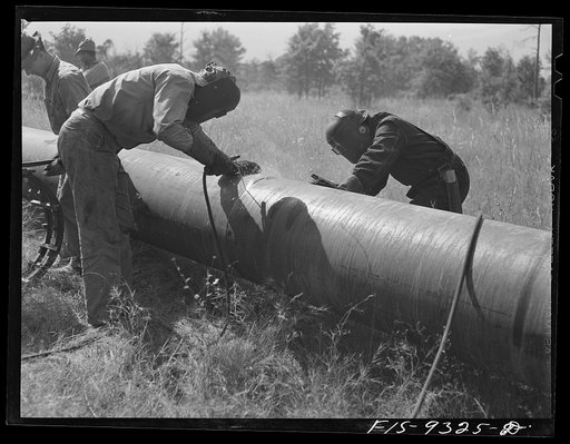 Arkansas-Texas state line to Gurdon, Arkansas. War emergency pipeline from Longview, Texas to Norris City, Illinois. Electric welders at work