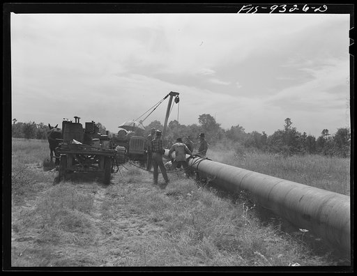 Untitled photo, possibly related to: Little Rock, Arkansas to Missouri-Arkansas state line. War emergency pipeline from Longview, Texas to Norris City, Illinois. Cleaning and priming pipe