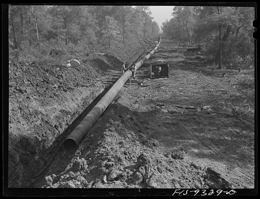 Arkansas-Texas state line to Gurdon, Arkansas. War emergency pipeline from Longview, Texas to Norris City, Illinois. Right-of-way of war emergency pipeline running through wooded land