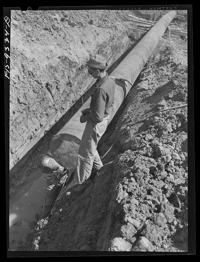 Arkansas-Texas state line to Gurdon, Arkansas. War emergency pipeline from Longview, Texas to Norris City, Illinois.  Tackwelding metal cover over end of pipe