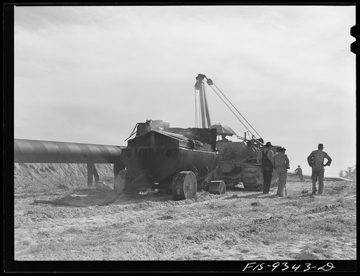 Longview, Texas to Arkansas state line. War emergency pipeline from Longview, Texas to Norris City, Illinois. Wrapping primed pipe with felt