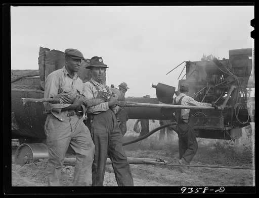 Longview, Texas to Arkansas state line. War emergency pipeline from Longview, Texas to Norris City, Illinois. Doping crew wrapping pipe with felt