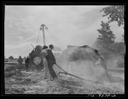 Untitled photo, possibly related to: Longview, Texas to Arkansas state line. War emergency pipeline from Longview, Texas to Norris City, Illinois. Wrapping primed pipe with felt