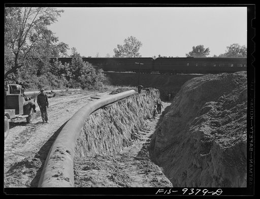 Longview, Texas to Arkansas state line. War emergency pipeline from Longview, Texas to Norris, Illinois. The pipeline approaching a railroad crossing under which it will tunnel