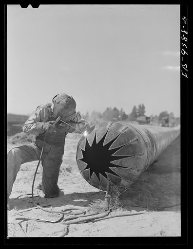 Longview, Texas to Arkansas state line. War emergency pipeline from Longview, Texas to Norris City, Illinois. Making bull nose plug in casing for pipe going under railroad tracks