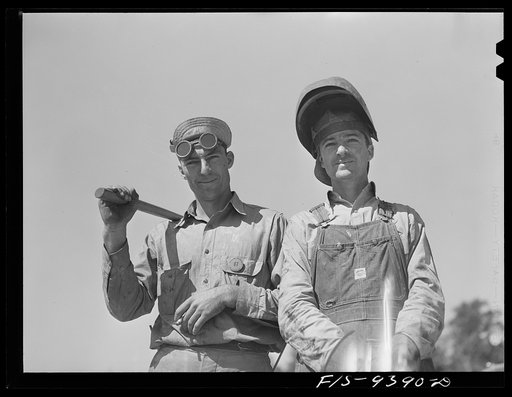 Untitled photo, possibly related to: Longview, Texas to Arkansas state line. War emergency pipeline from Longview, Texas to Norris City, Illinois. Welder and helper