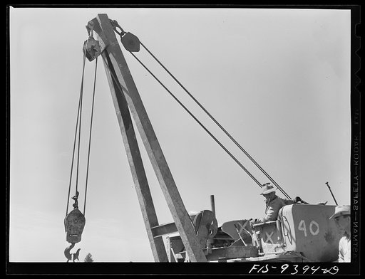 Longview, Texas to Arkansas state line. War emergency pipeline from Longview, Texas to Norris City, Illinios. Caterpillar tractor and crane used in hoisting sections of pipe