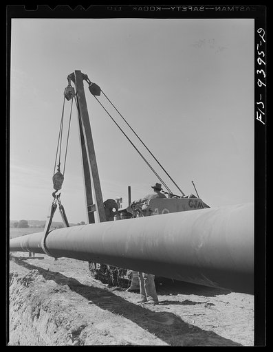 Longview, Texas to Arkansas state line. War emergency pipeline from Longview, Texas to Norris City, Illinois. Hoisting section of a pipe preparatory to laying it
