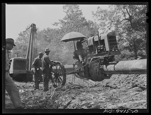 Little Rock, Arkansas to Missouri-Arkansas state line. War emergency pipeline from Longview, Texas to Norris City, Illinois. Priming machine coating pipe with hot asphalt paint