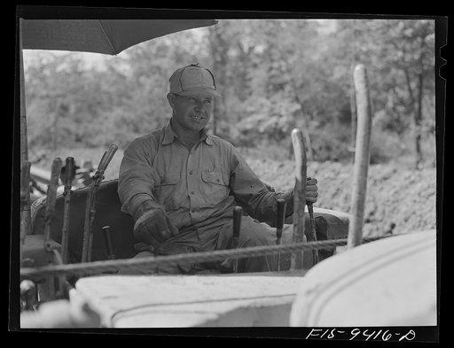Untitled photo, possibly related to: Little Rock, Arkansas to Missouri-Arkansas state line. War emergency pipeline from Longview, Texas to Norris City, Illinois. Priming machine coating pipe with hot asphalt paint