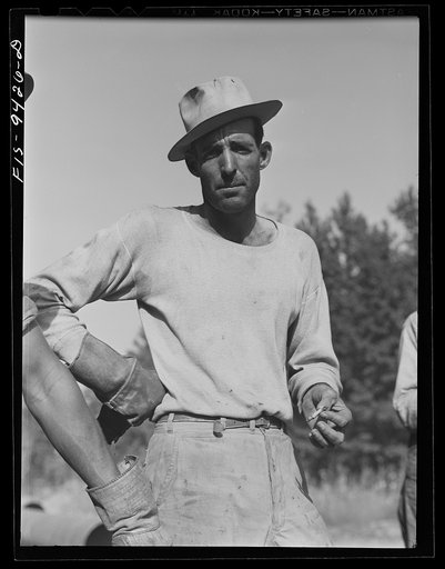 Untitled photo, possibly related to: Little Rock, Arkansas to Missouri-Arkansas state line. War emergency pipeline from Longview, Texas to Norris City, Illinois. A member of the pipe laying gang