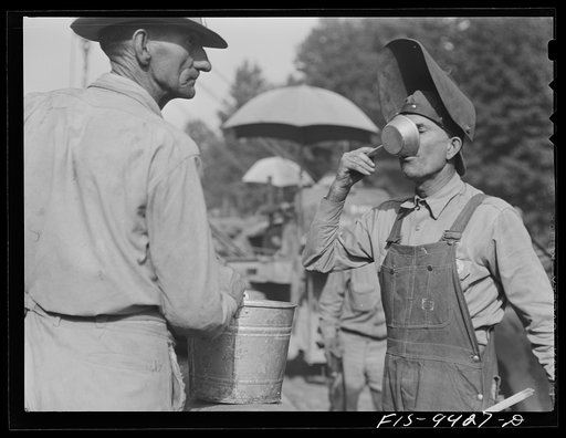 Untitled photo, possibly related to: Little Rock, Arkansas to Missouri-Arkansas state line. War emergency pipeline from Longview, Texas to Norris City, Illinois. Welder getting a drink water