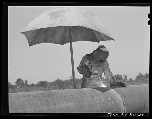 Longview, Texas to Arkansas state line. War emergency pipeline from Longview, Texas to Norris City, Illinois. Electric welder