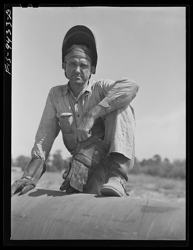Longview, Texas to Arkansas state line. War emergency pipeline from Longview, Texas to Norris City, Illinois. Electric welder