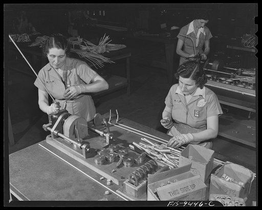 De Soto bomber plant, Detroit, Michigan. Threading ends of pipe and attaching bolts