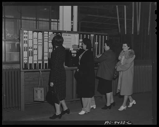 De Sota bomber plant. Detroit, Michigan. War workers checking out at the end of a shift