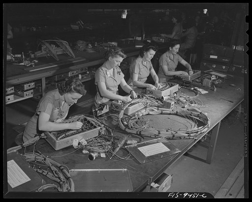 De Soto bomber plant. Detroit, Michigan. Tables showing women workers assembling complex control box