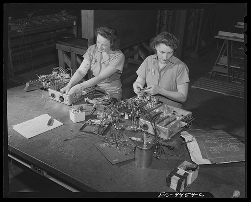 De Soto bomber plant, Detroit, Michigan. Tables showing women workers assembling complex control box