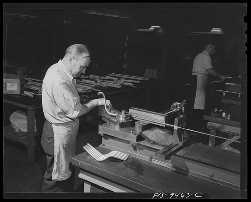De Soto bomber plant. Detroit, Michigan. Worker using a bending machine