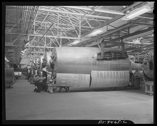 De Soto bomber plant. Detroit, Michigan. General view showing assembly line of mid-section of B-26 bomber. Picture shows how bomber parts are suspended by overhead conveyor