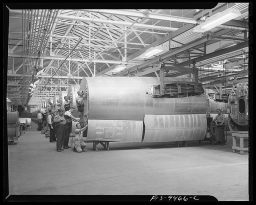 De Soto bomber plant. Detroit, Michigan. General view showing assembly line of mid-section of B-26 bomber. Picture shows how bomber parts are suspended by overhead conveyor