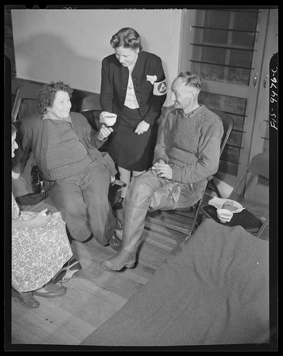 Washington, D.C. United States Office of Civilian Defense workers serving hot coffee to people driven from their homes by flood water