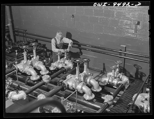 Tulsa, Oklahoma. Circulating pumps for engine manifolds in the boiler room at the Great Lakes pumping station