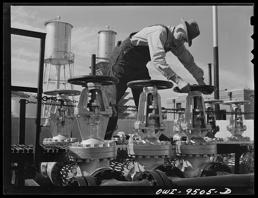 Untitled photo, possibly related to: Tulsa, Oklahoma. Operating a gate valve which controls the flow of refined products through the Tulsa station of the Great Lakes pipeline. This line sends gasoline from Oklahoma to Minneapolis