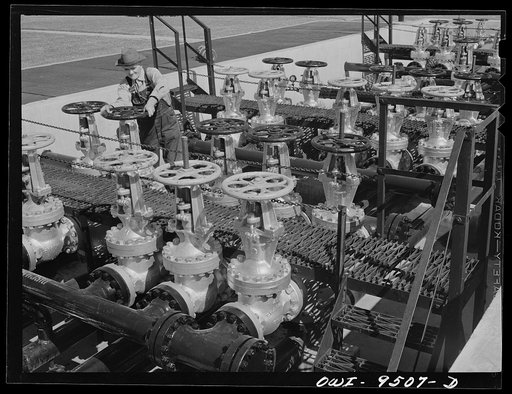 Untitled photo, possibly related to: Tulsa, Oklahoma. Operating a gate valve which controls the flow of refined products through the Tulsa station of the Great Lakes pipeline. This line sends gasoline from Oklahoma to Minneapolis