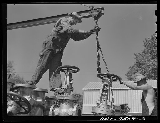 Untitled photo, possibly related to: Tulsa, Oklahoma. Repairing gate valves at the Tulsa station of the Great Lakes pipeline company