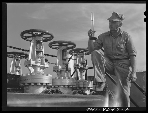 Tulsa, Oklahoma. Examining a sample of gasoline taken from the flow at the Tulsa pumping station of the Great Lakes pipeline